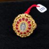 Anillo dorado con Virgen y rubíes